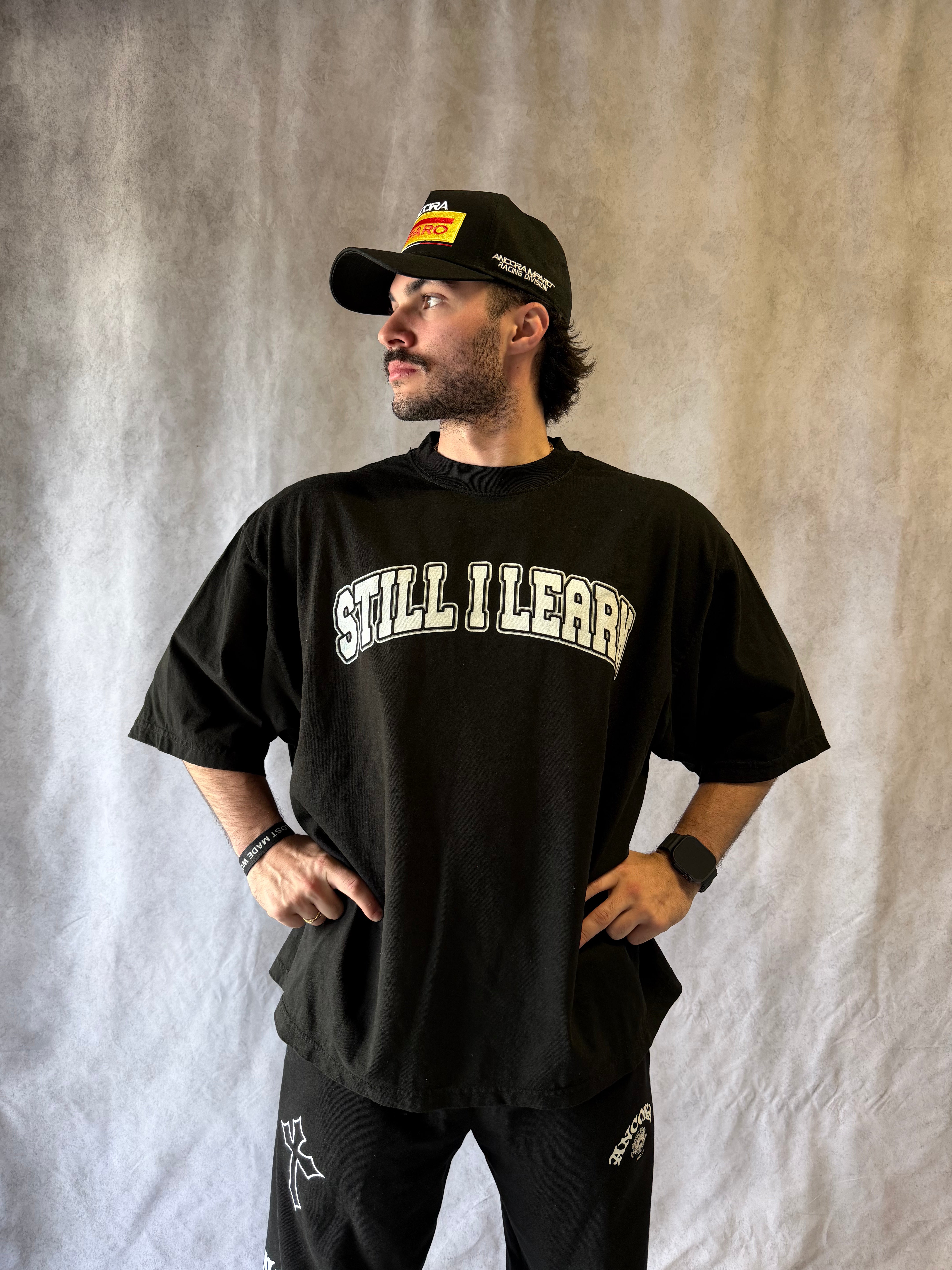 STILL I LEARN WORLD TOUR TEE - BLACK
