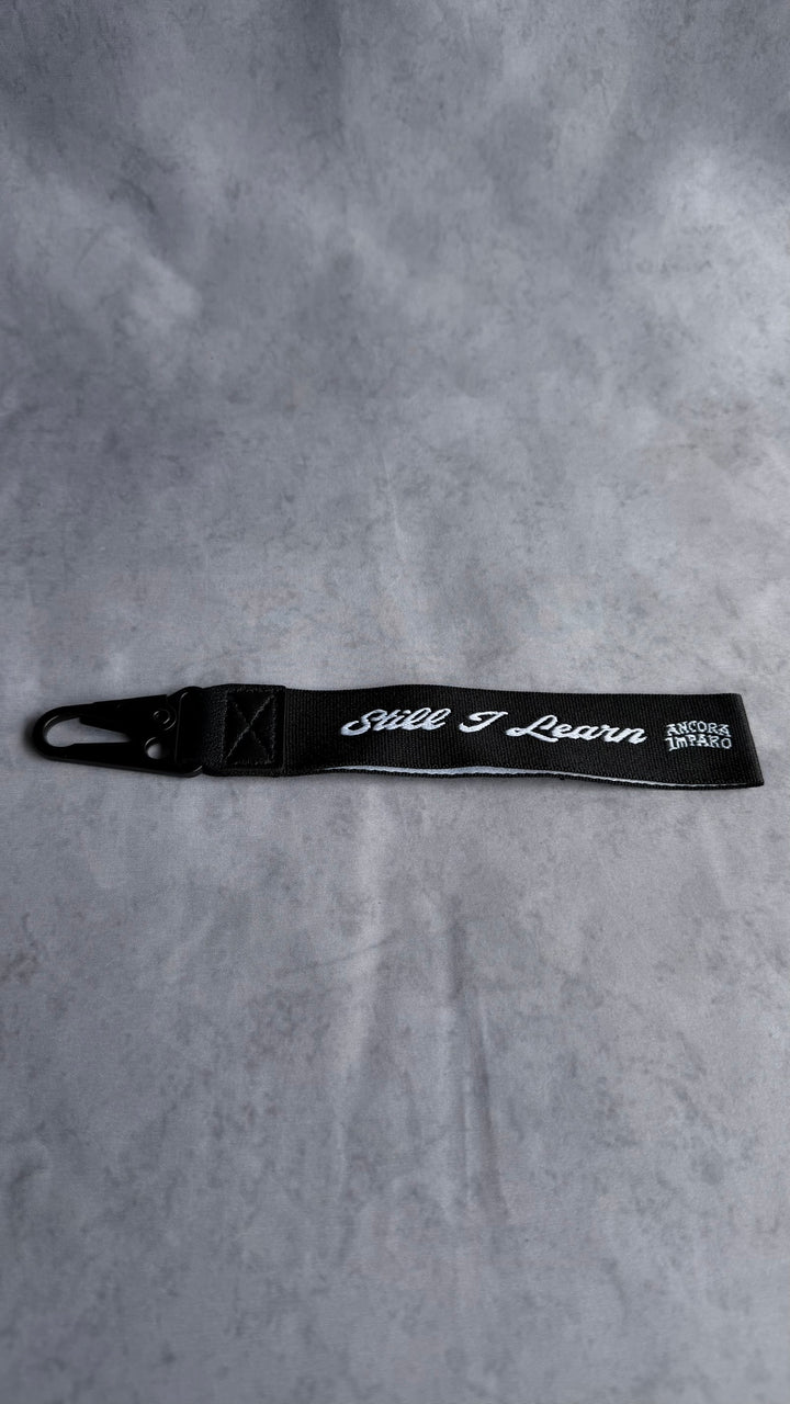 STILL I LEARN KEY STRAP