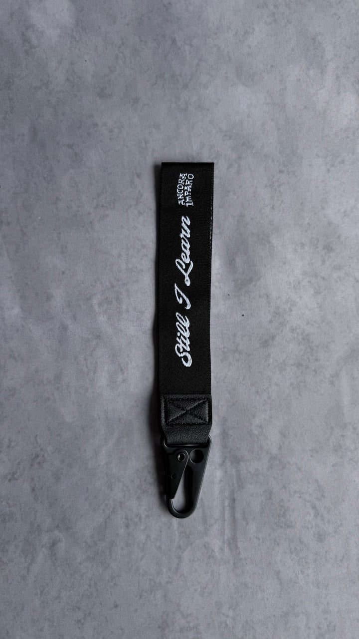 STILL I LEARN KEY STRAP