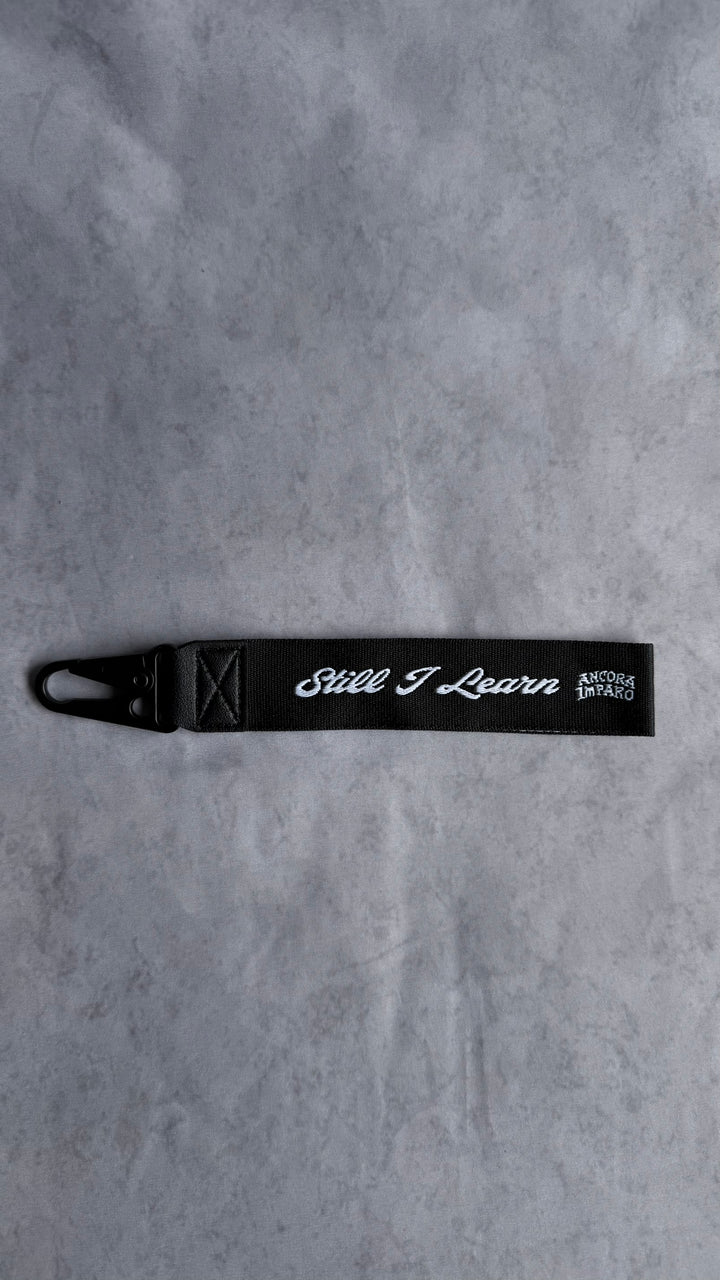 STILL I LEARN KEY STRAP